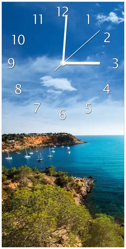 Neue Ware Wanduhr aus Acryl Ibiza - Blick von einer Bucht aufs Meer 30 x 60 cm, mit schwarzen Zeigern